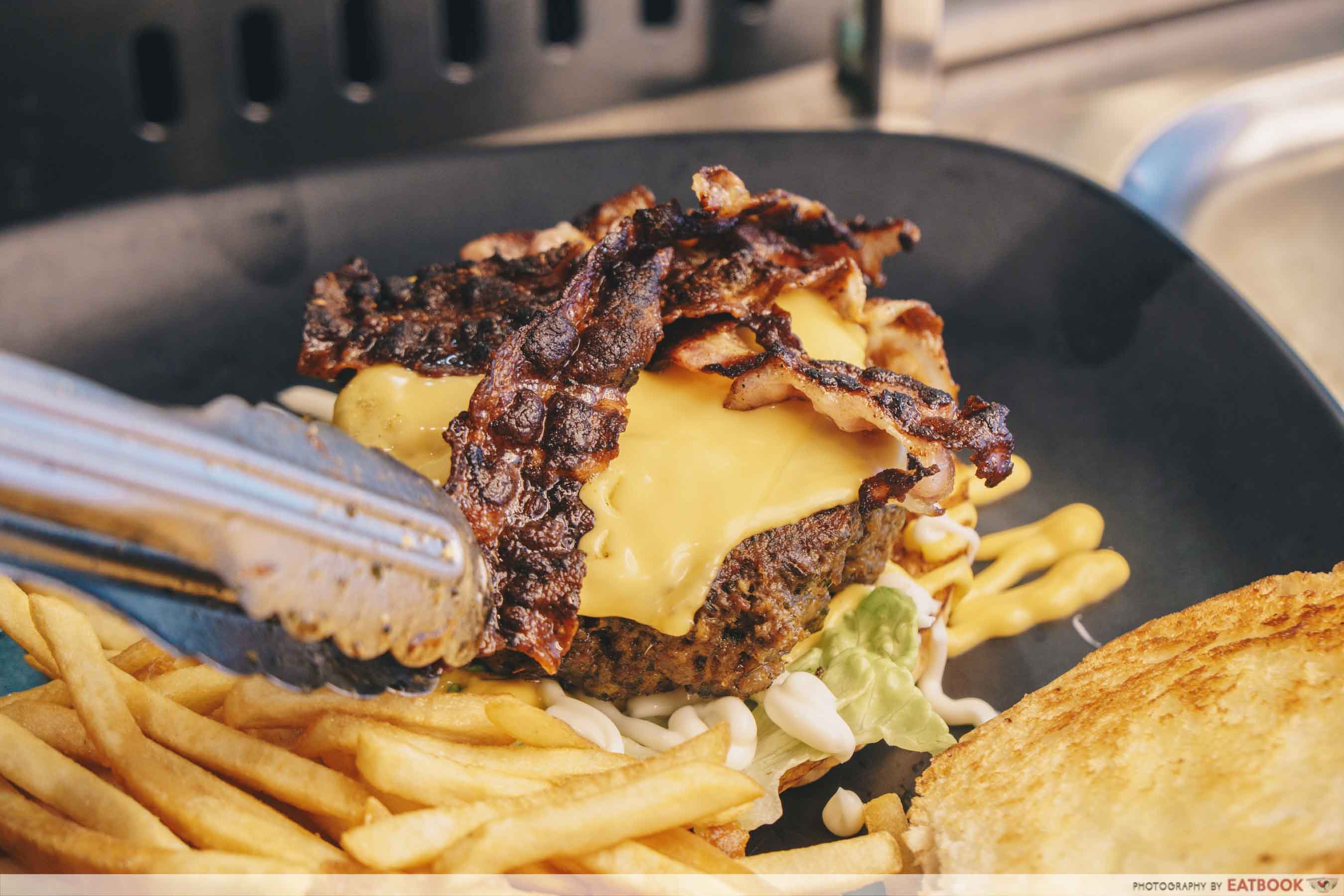 Roger's Kitchen wagyu lava egg beef burger plating