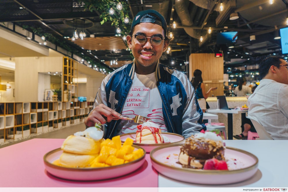 A man eating the pancakes