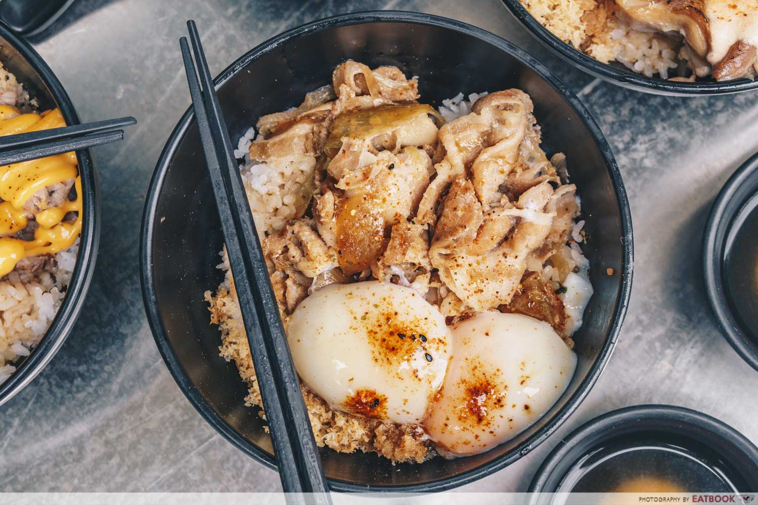 flatlay of iberico pork rice bowls