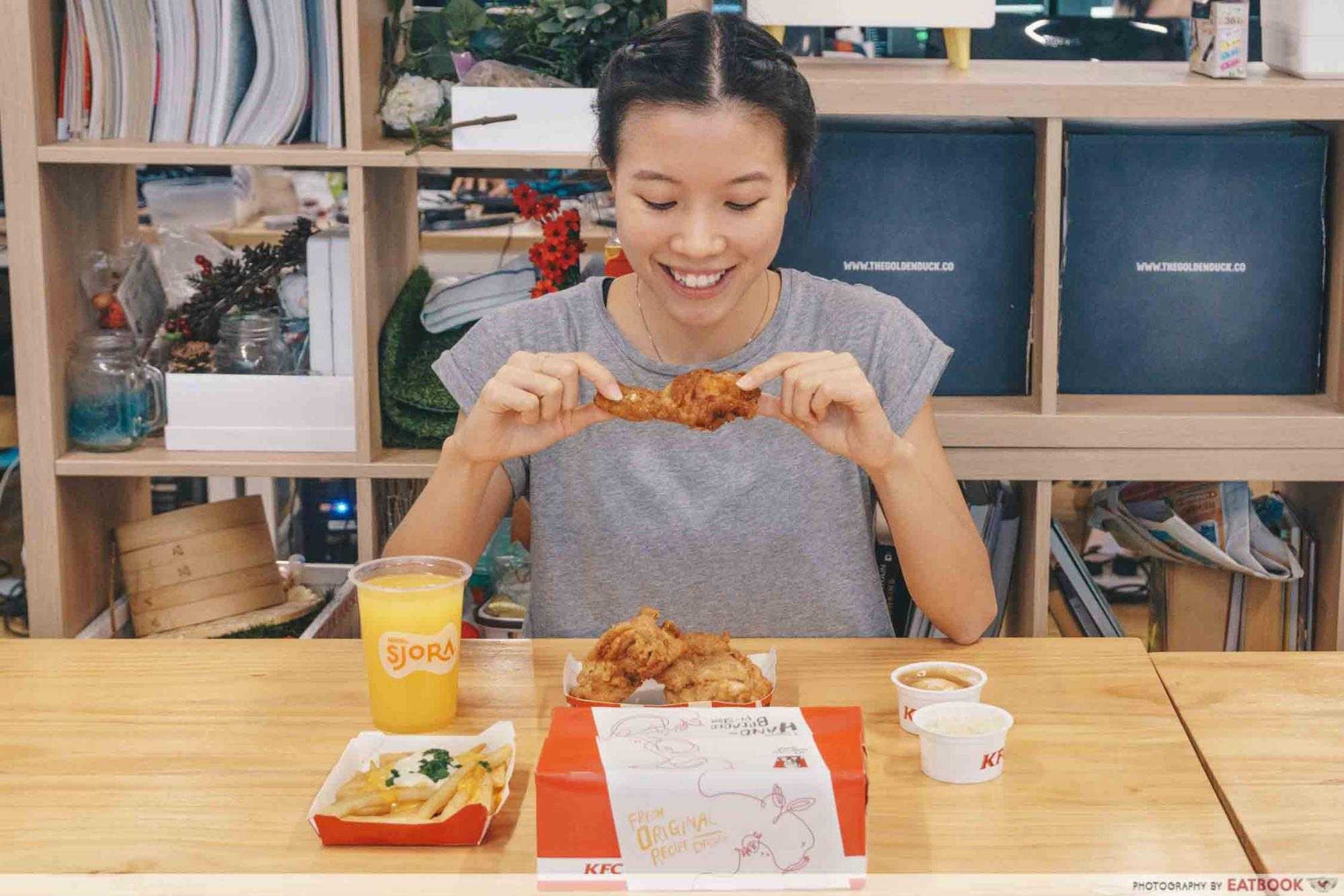 A girl eating KFC food