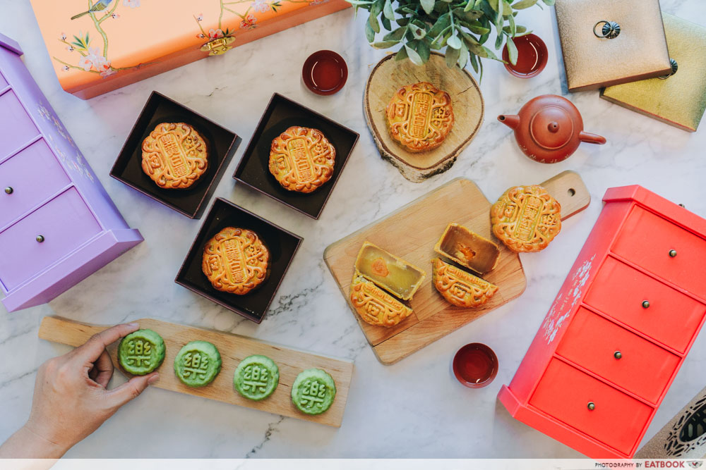 Flatlay of all the mooncakes with the boxes