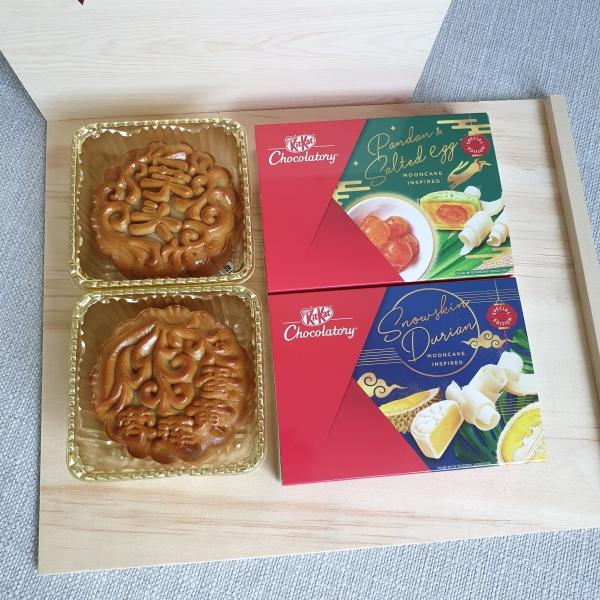 Boxes of mooncakes and KiKat