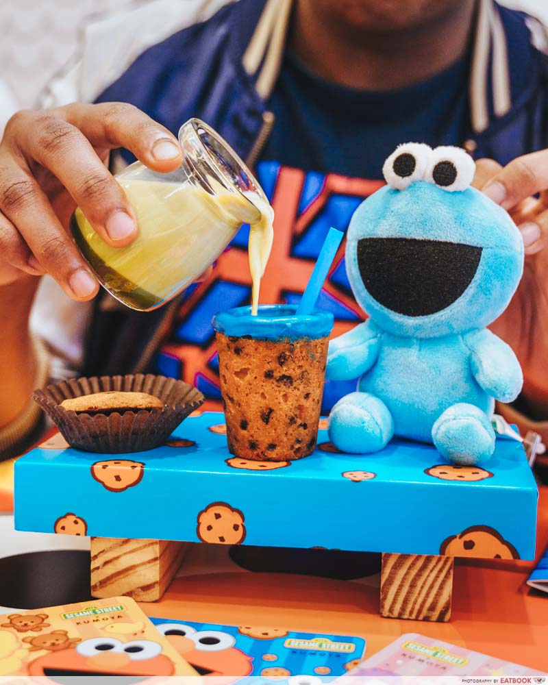 Pouring milk into a cookie cup