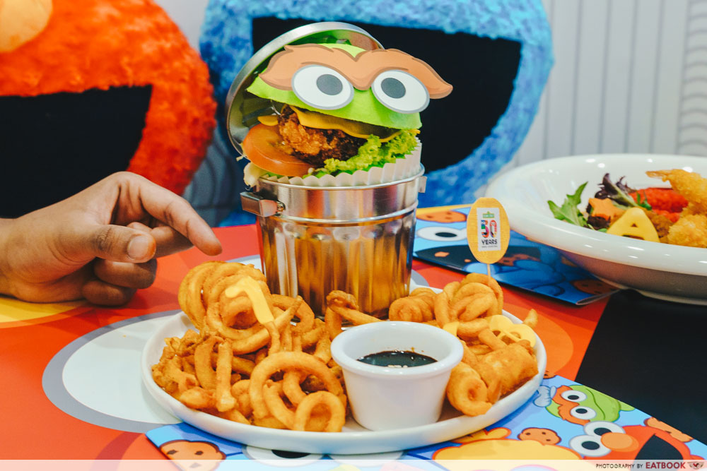 Green Burger on a trash can