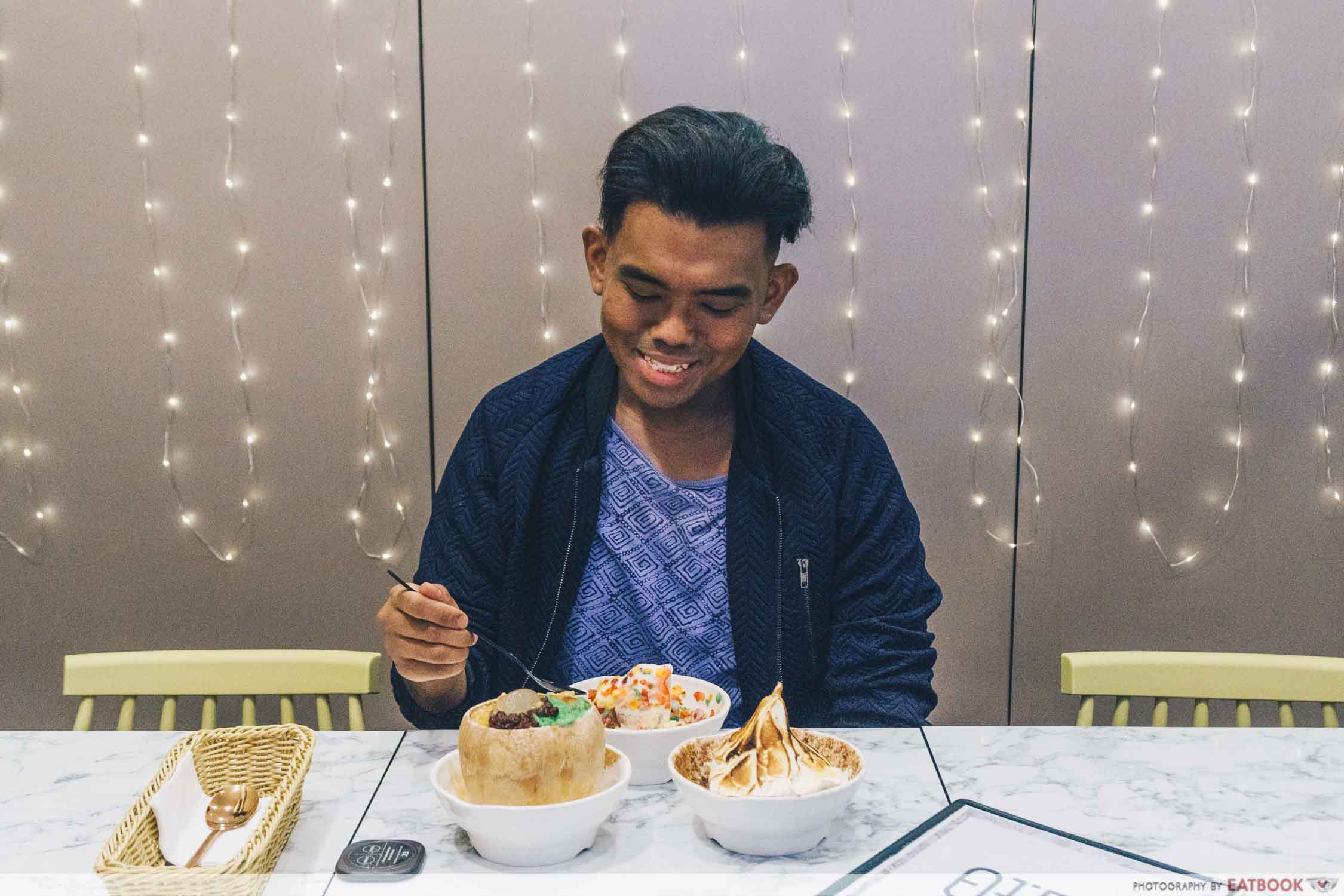 A guy eating desserts