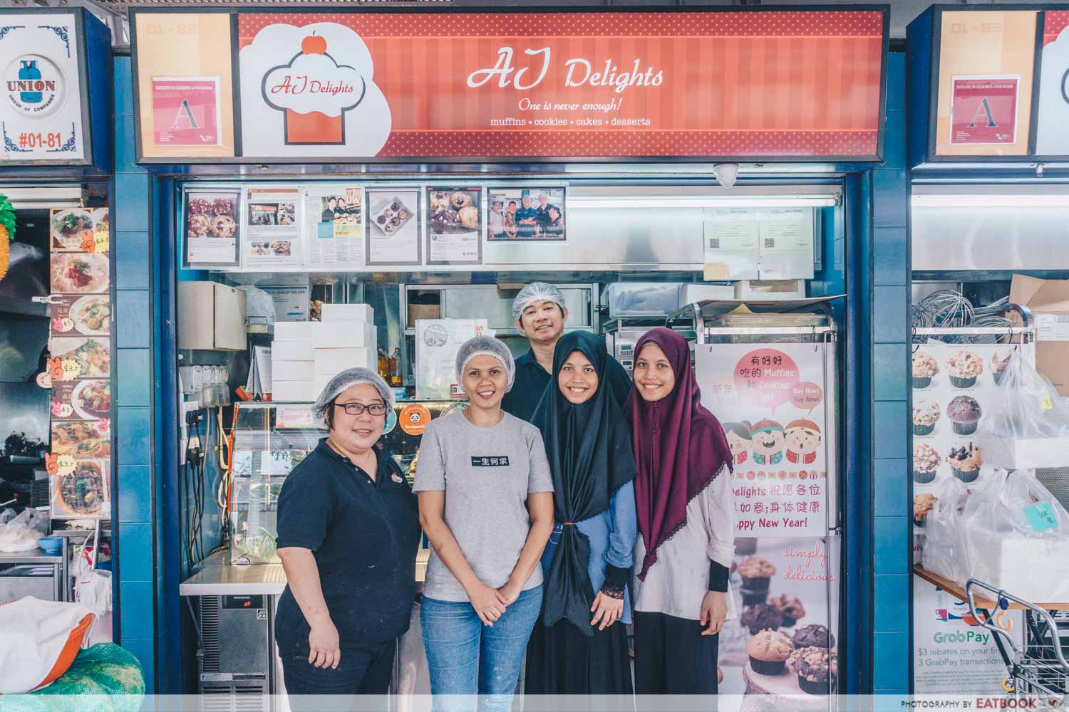 AJ Delights - Storefront shot with owners