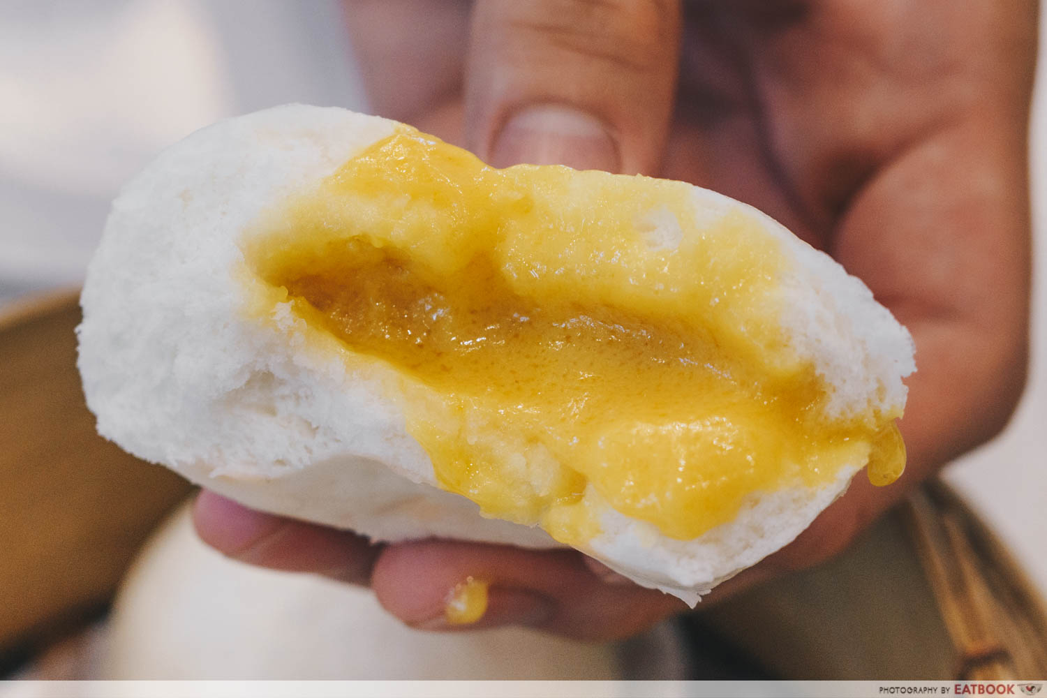 Sum Dim Sum - Closeup of golden custard bun