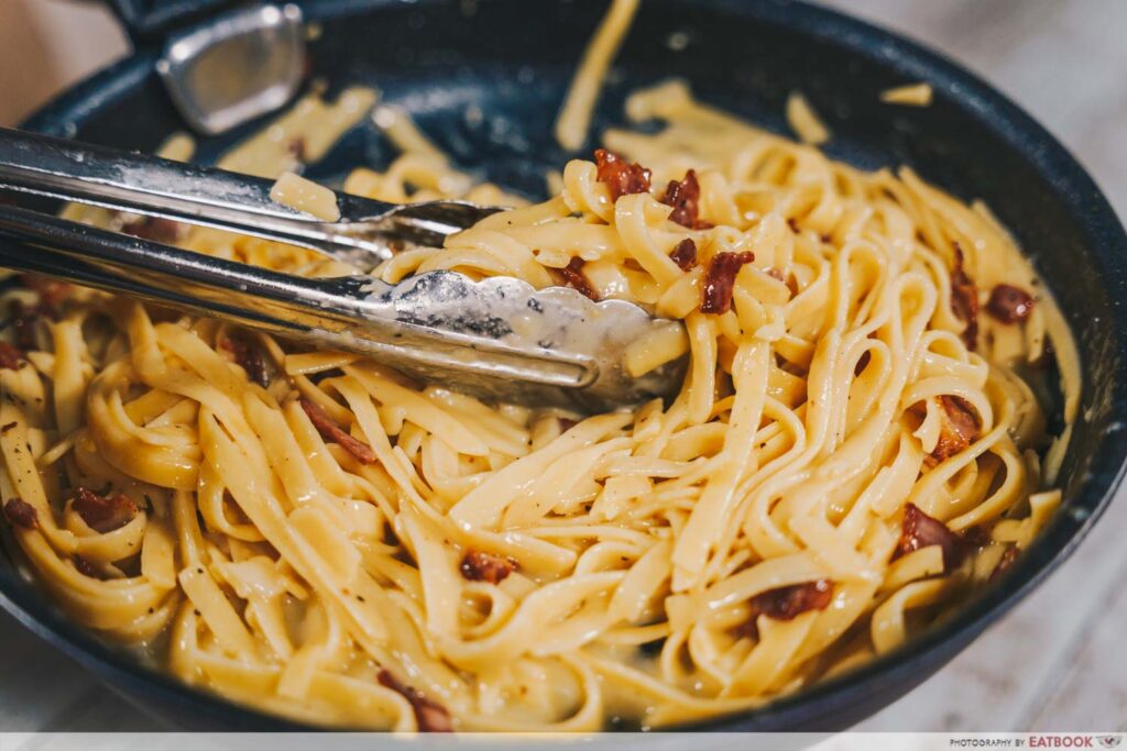 One-Pan Sriracha Pasta mixing