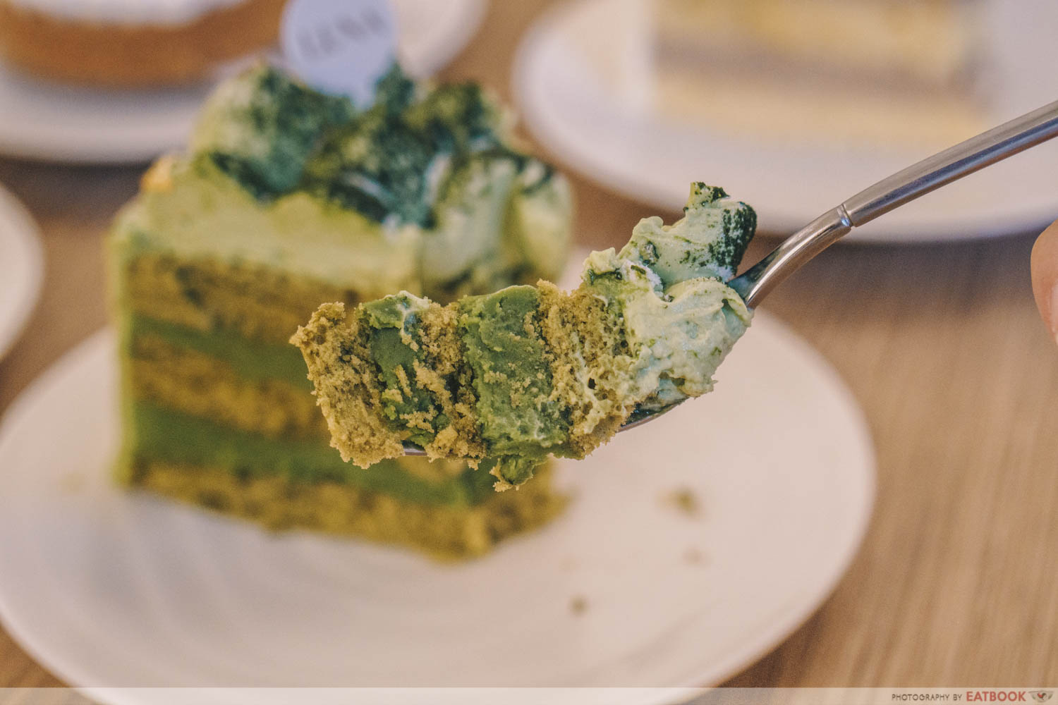 Matcha white chocolate cake slice