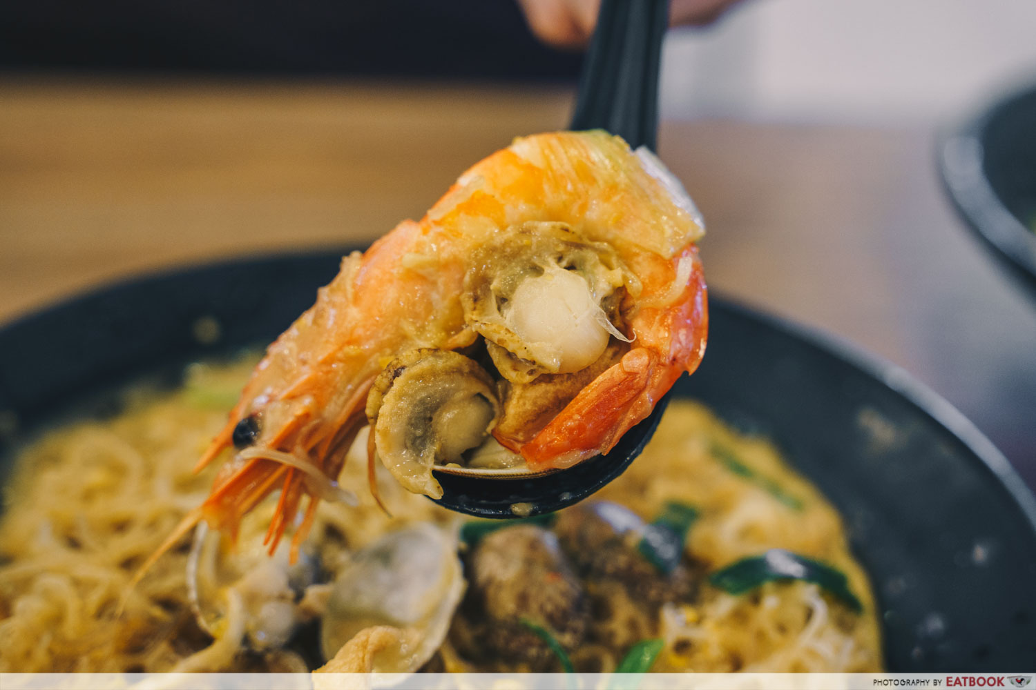 Try Fresh XO Seafood Noodles -Spoonful of seafood salted egg