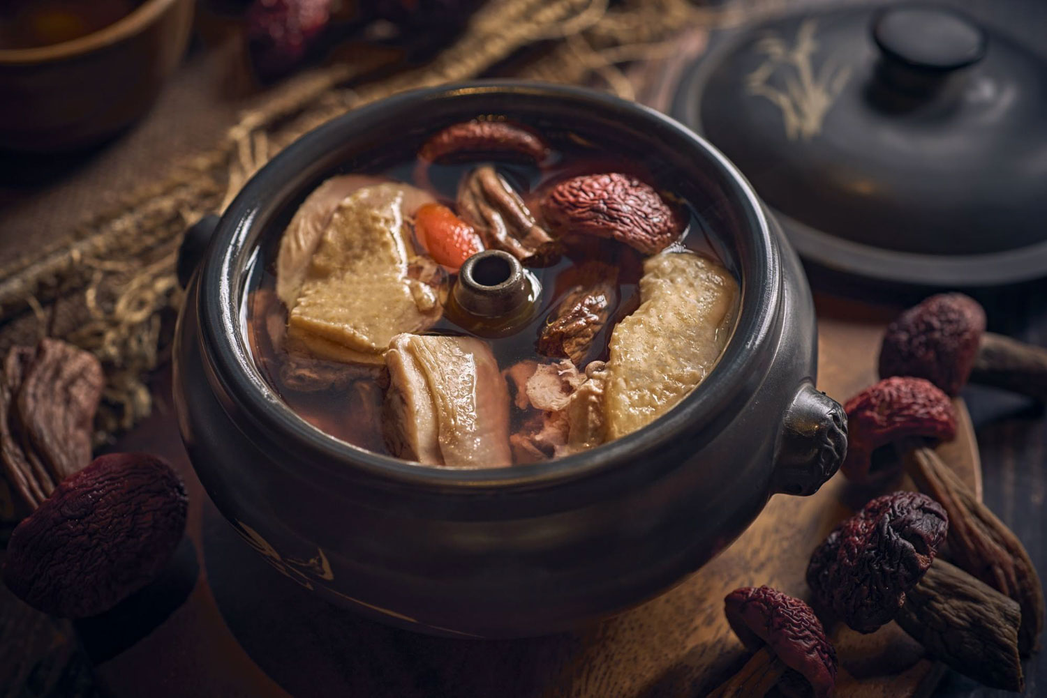 Yun Nans Nex - steamed pot chicken soup with red mushrooms