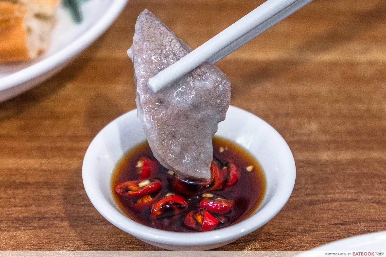 old shifu charcoal porridge - pork liver dipping shot