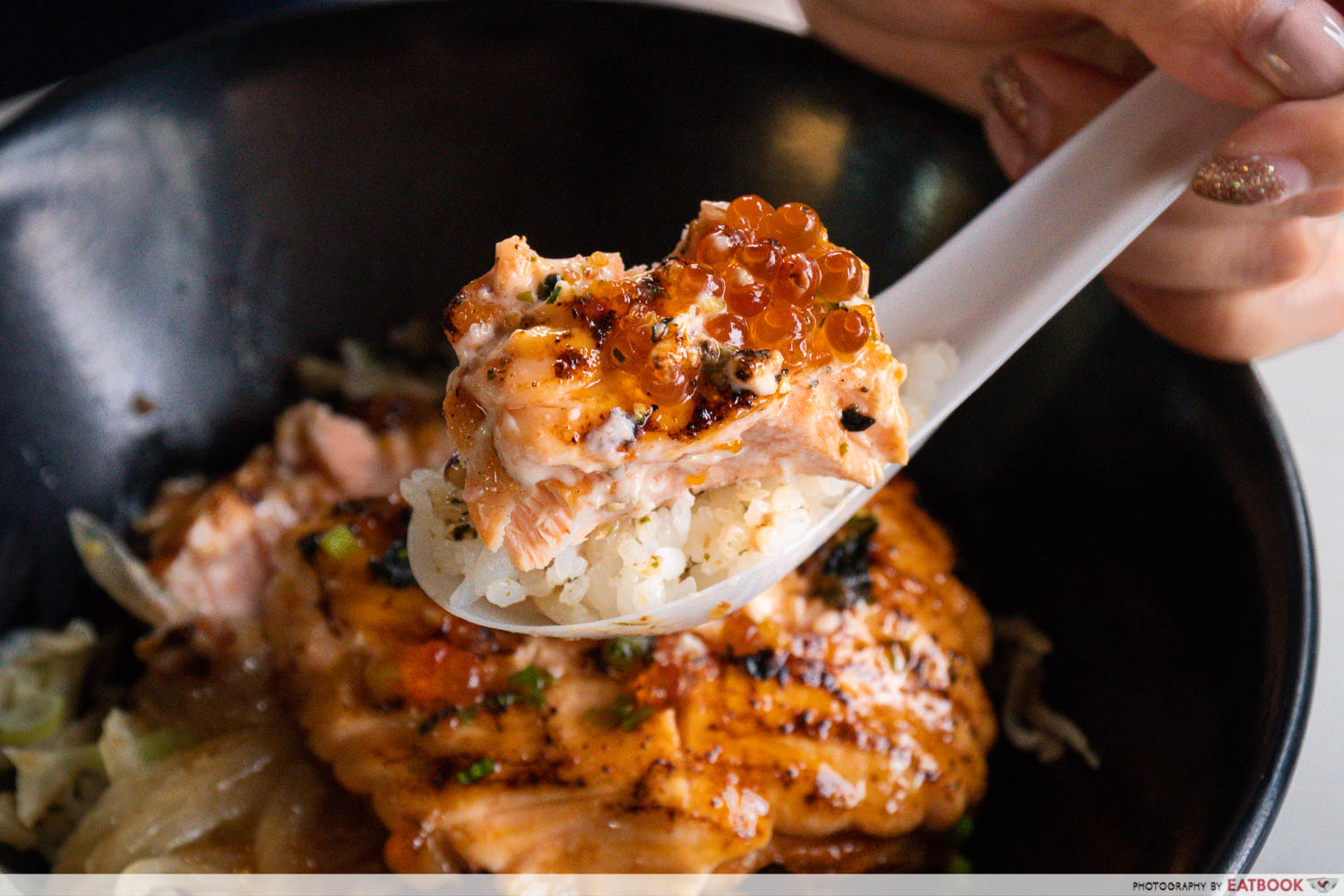 the gyu co - mentaiko rainbow trout don on spoon