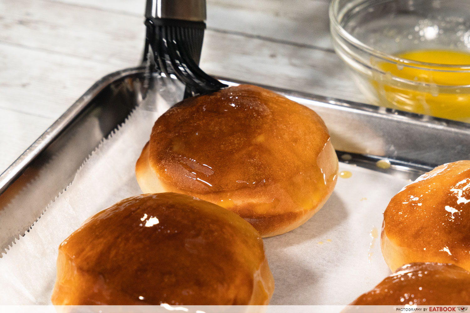 bomboloni - brushing butter