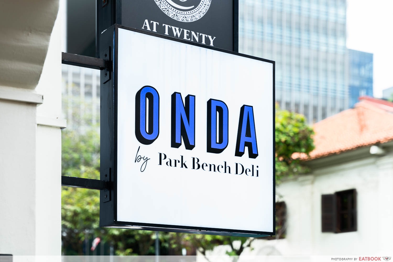 Onda by park bench deli storefront