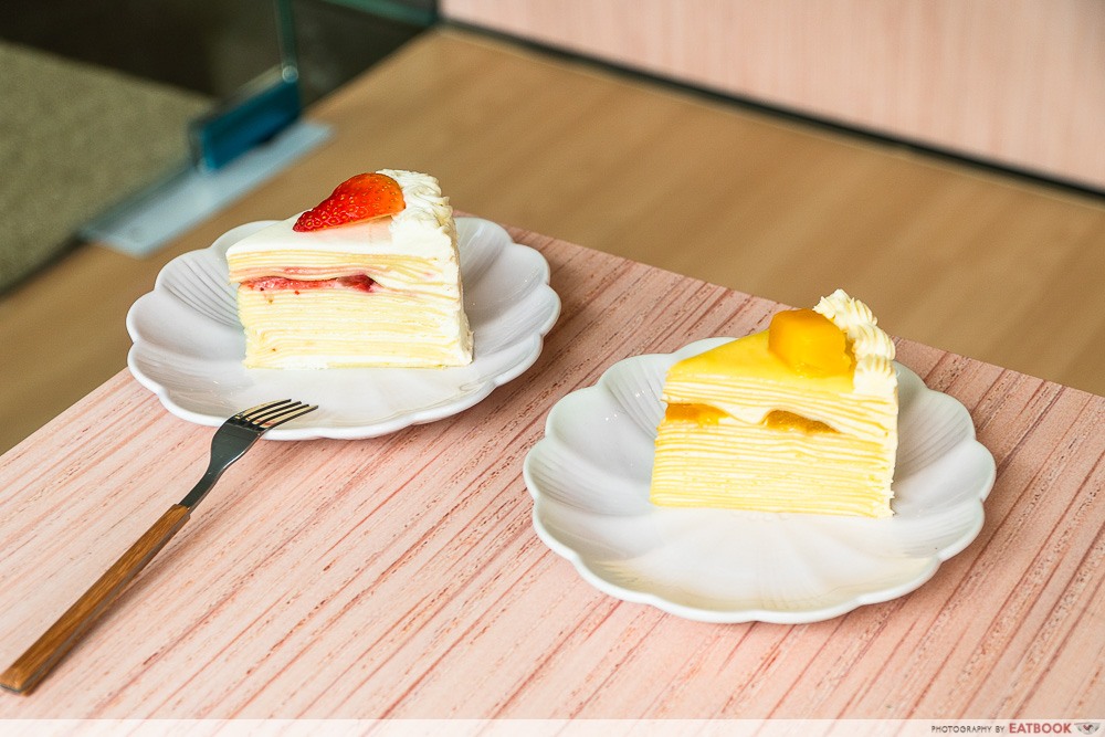 two boys baking crepe cakes in cafe