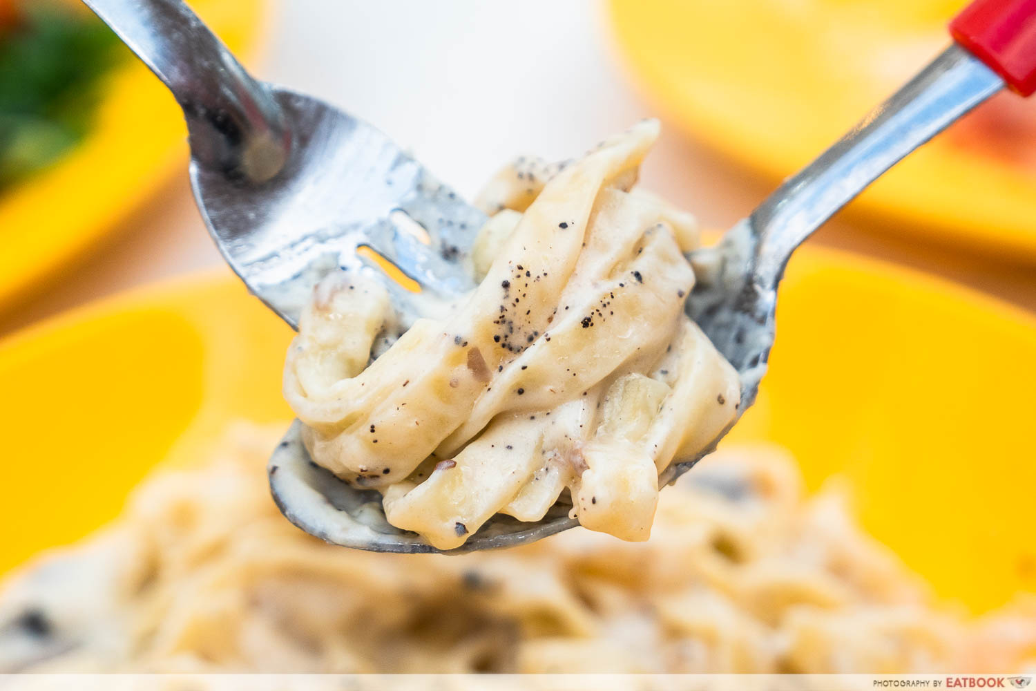 saporita truffle cheesewheel pasta interaction shot