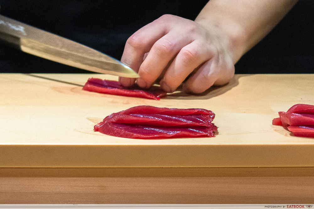 unkai sushi - slicing sashimi