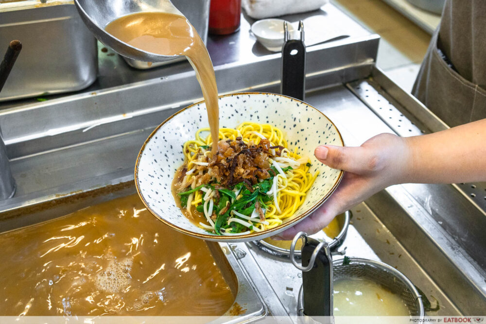 one prawn & co - pouring soup