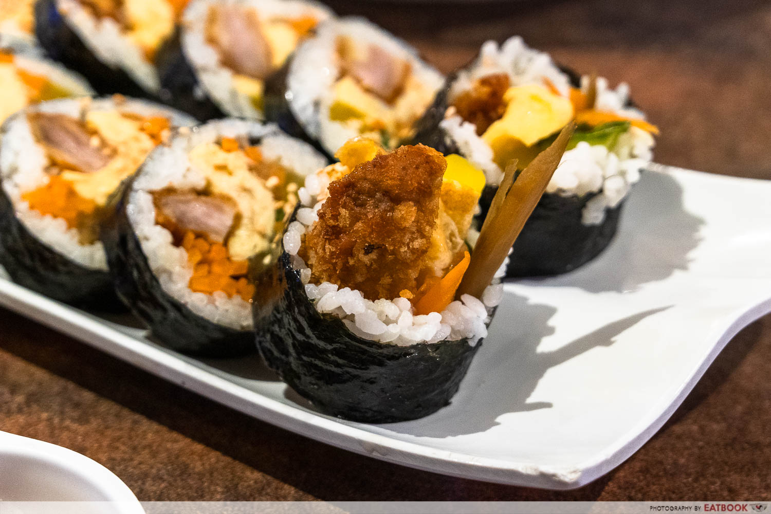 rolling rice traditional gimbap close up shot