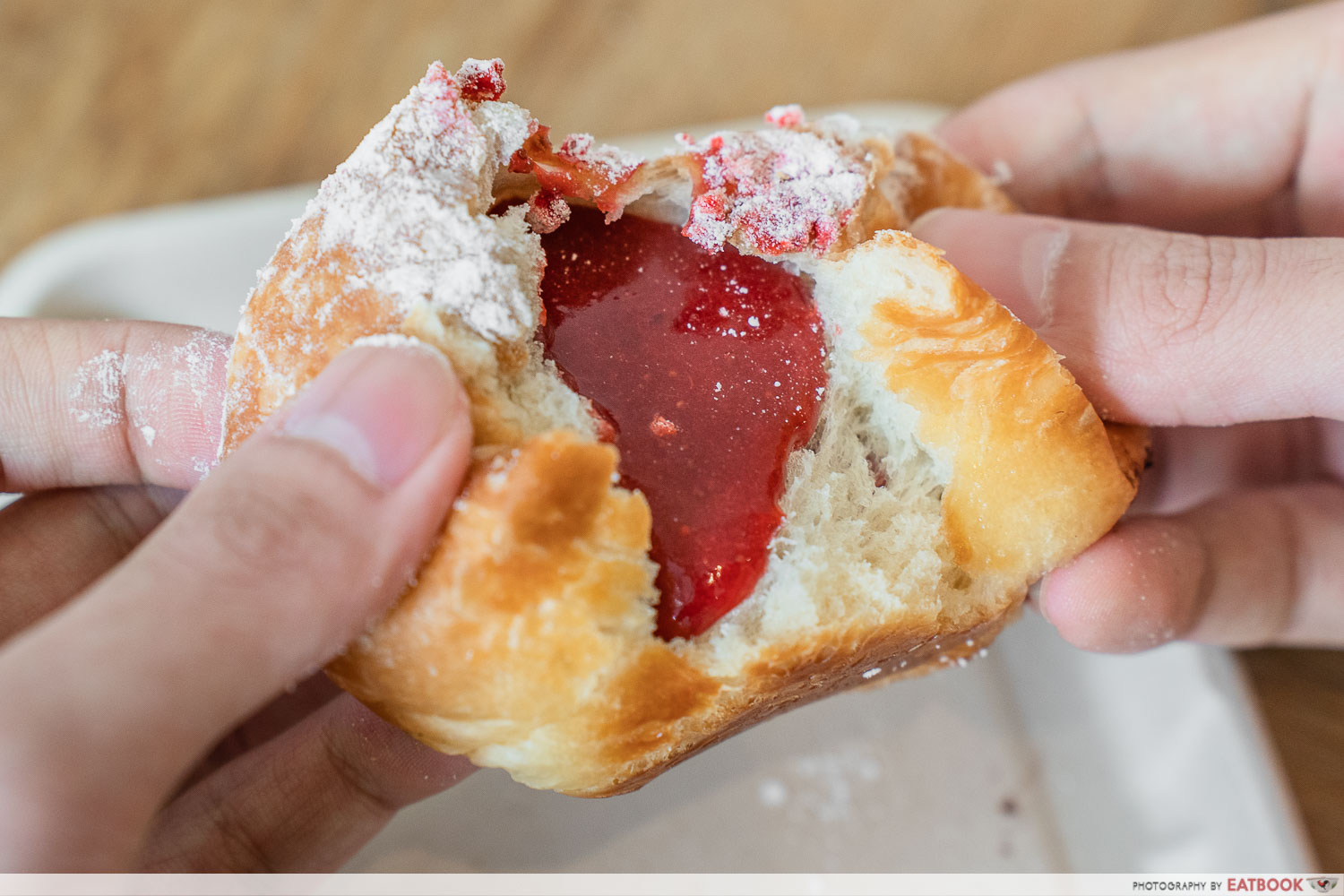 olsen bakehouse - strawberry mochi donut tearing