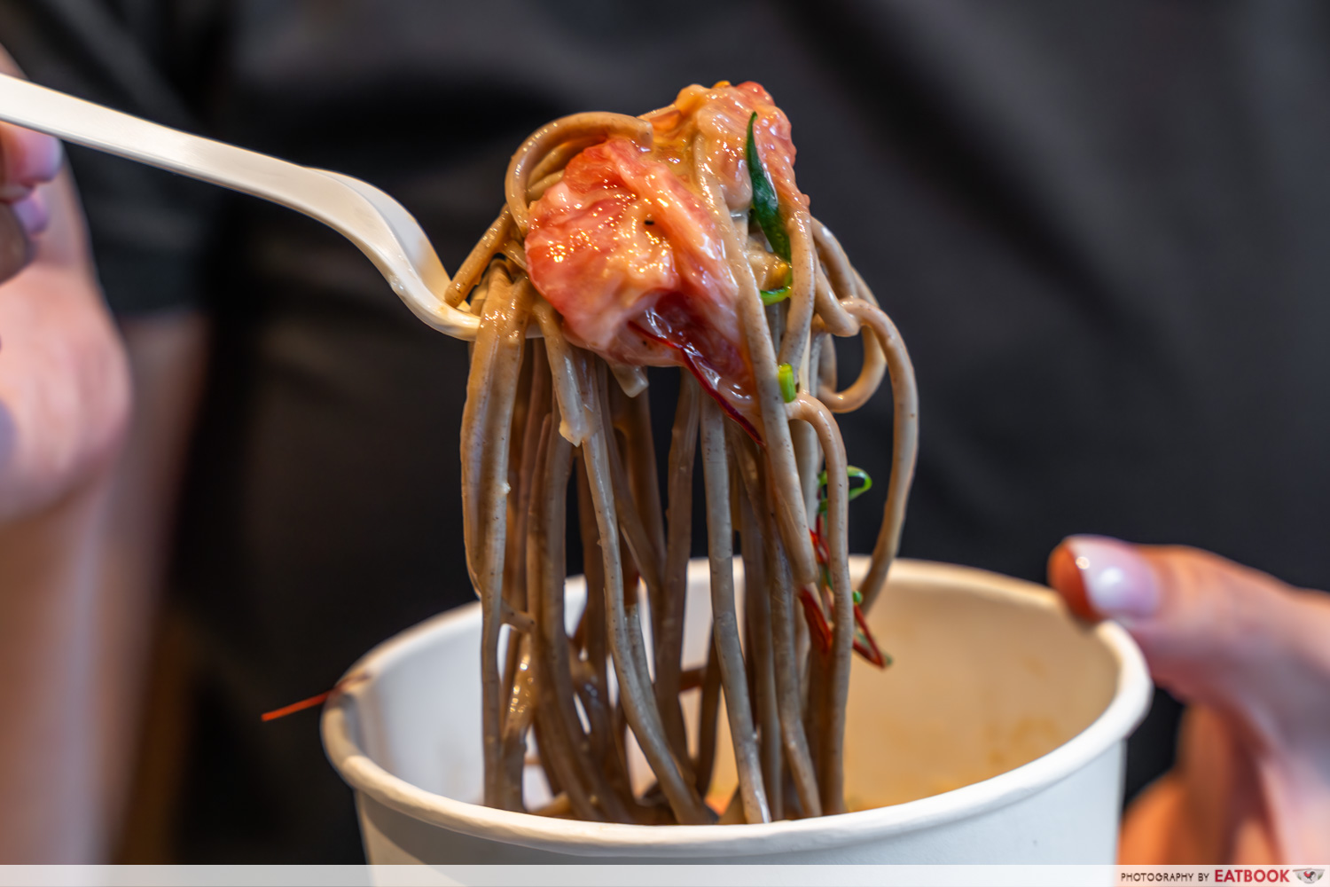 draft land - wagyu cold noodles on fork