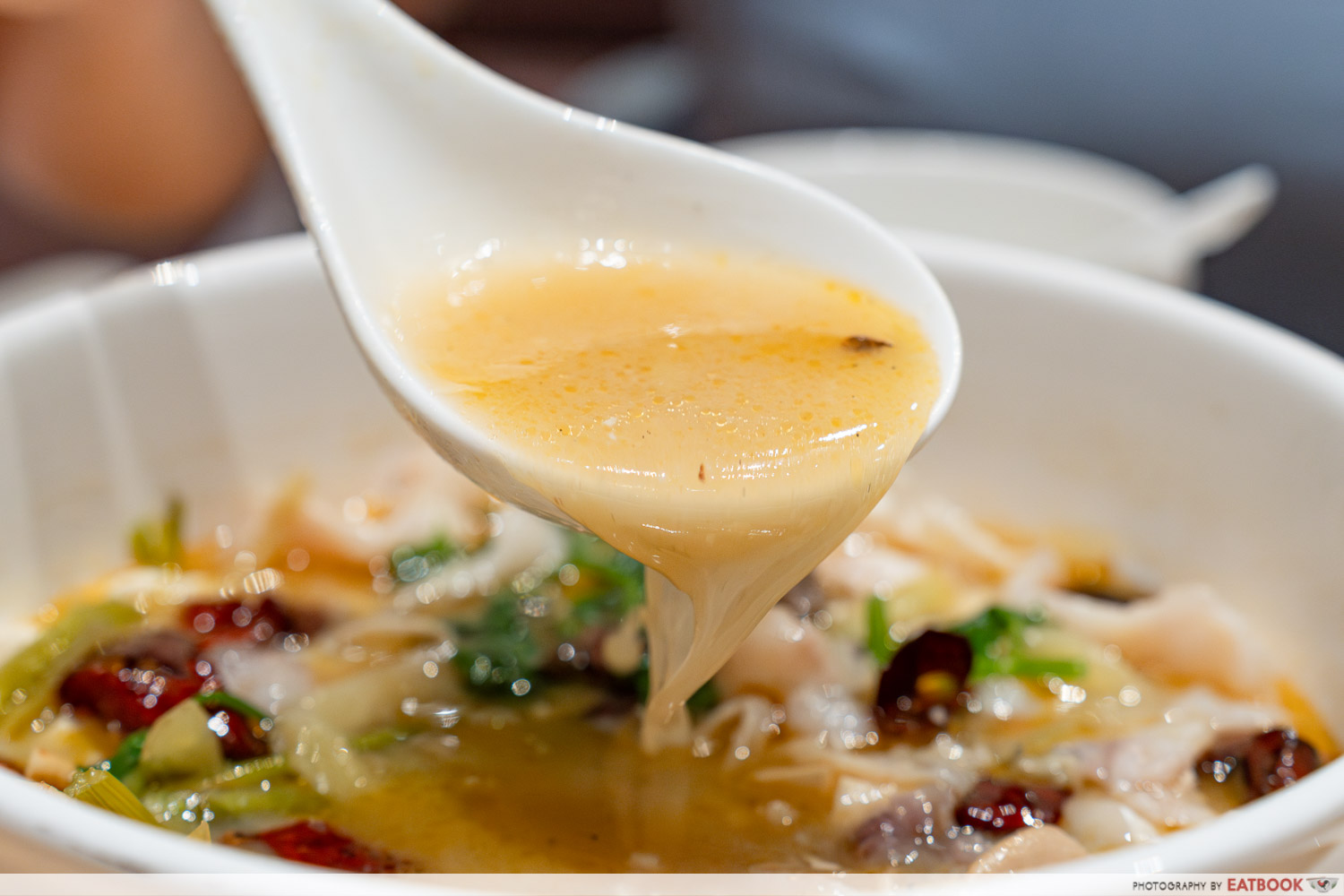 ju xing home - poached fish in sichuan chilli oil soup pour