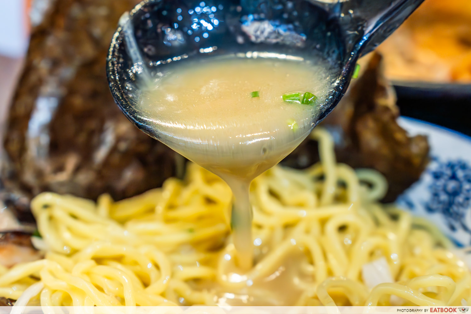 special-shio-ramen-soup-pour-spoon-closeup