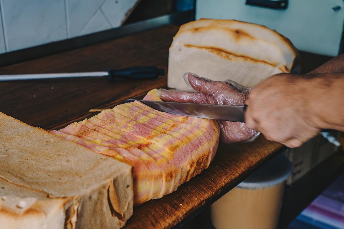 jie bakery tai seng - slicing rainbow bread