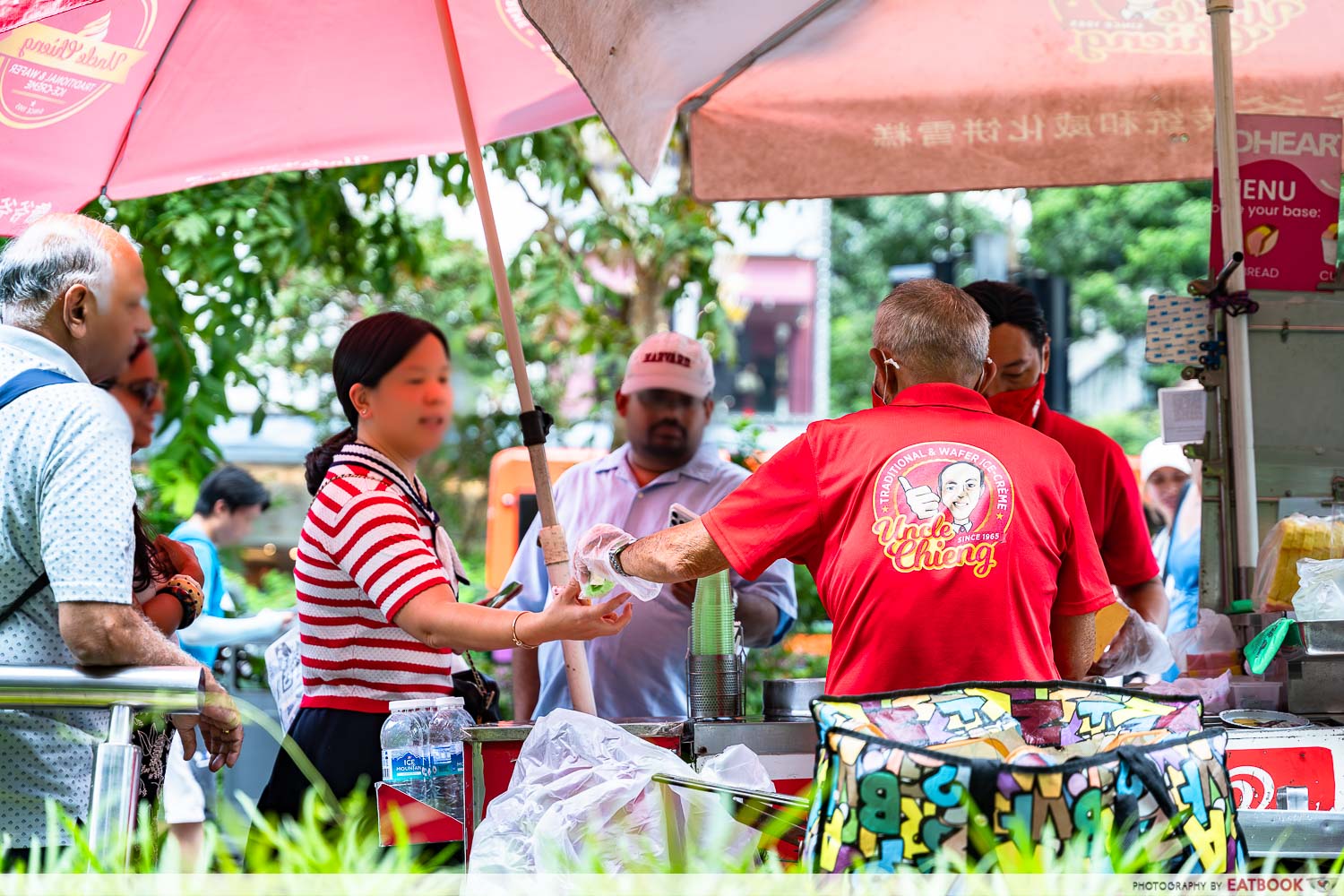 uncle-chieng-ice-cream-cart-btf-serving-customers-back-view-interaction