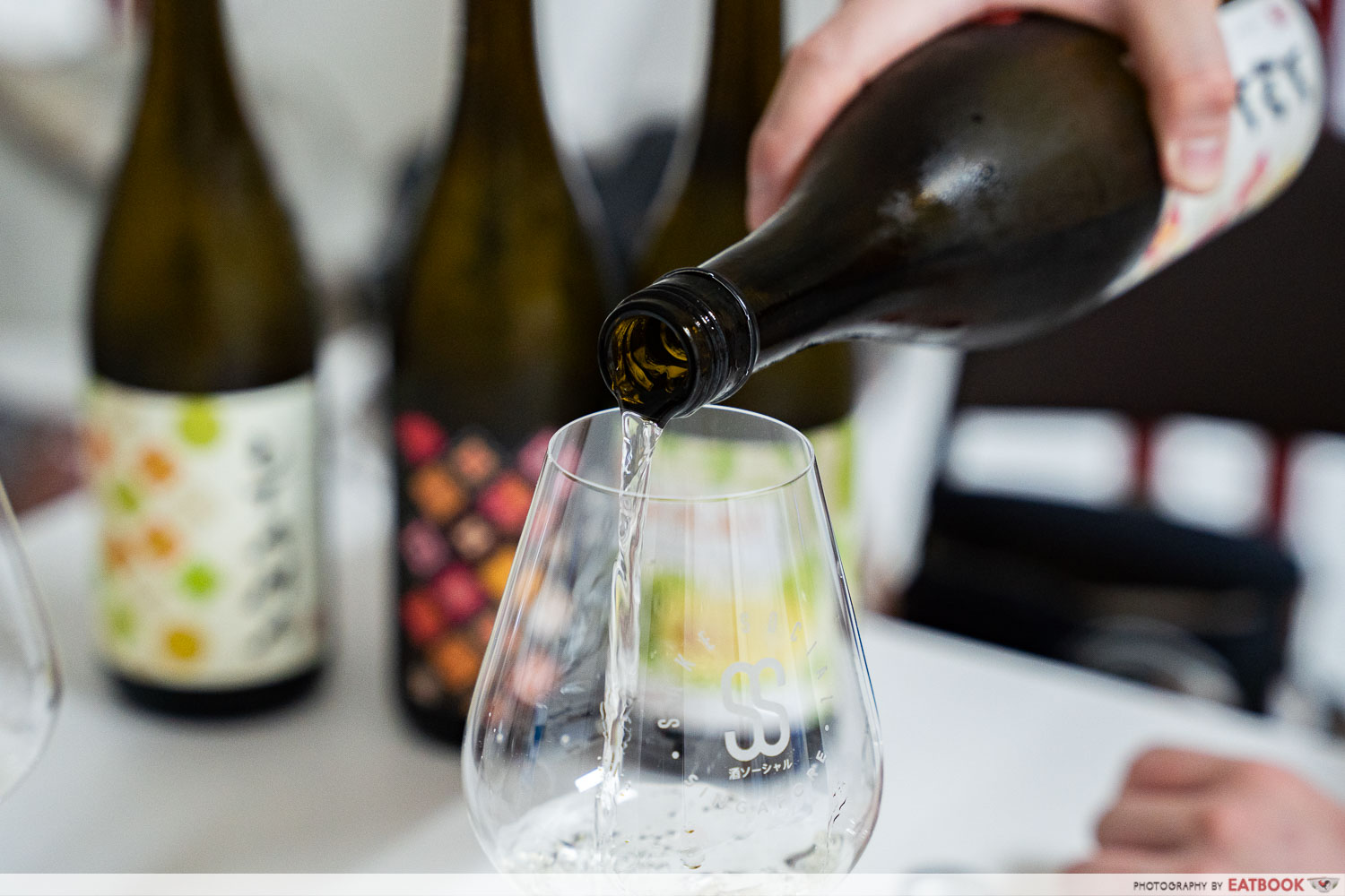 orchid-sake-brewery-pouring