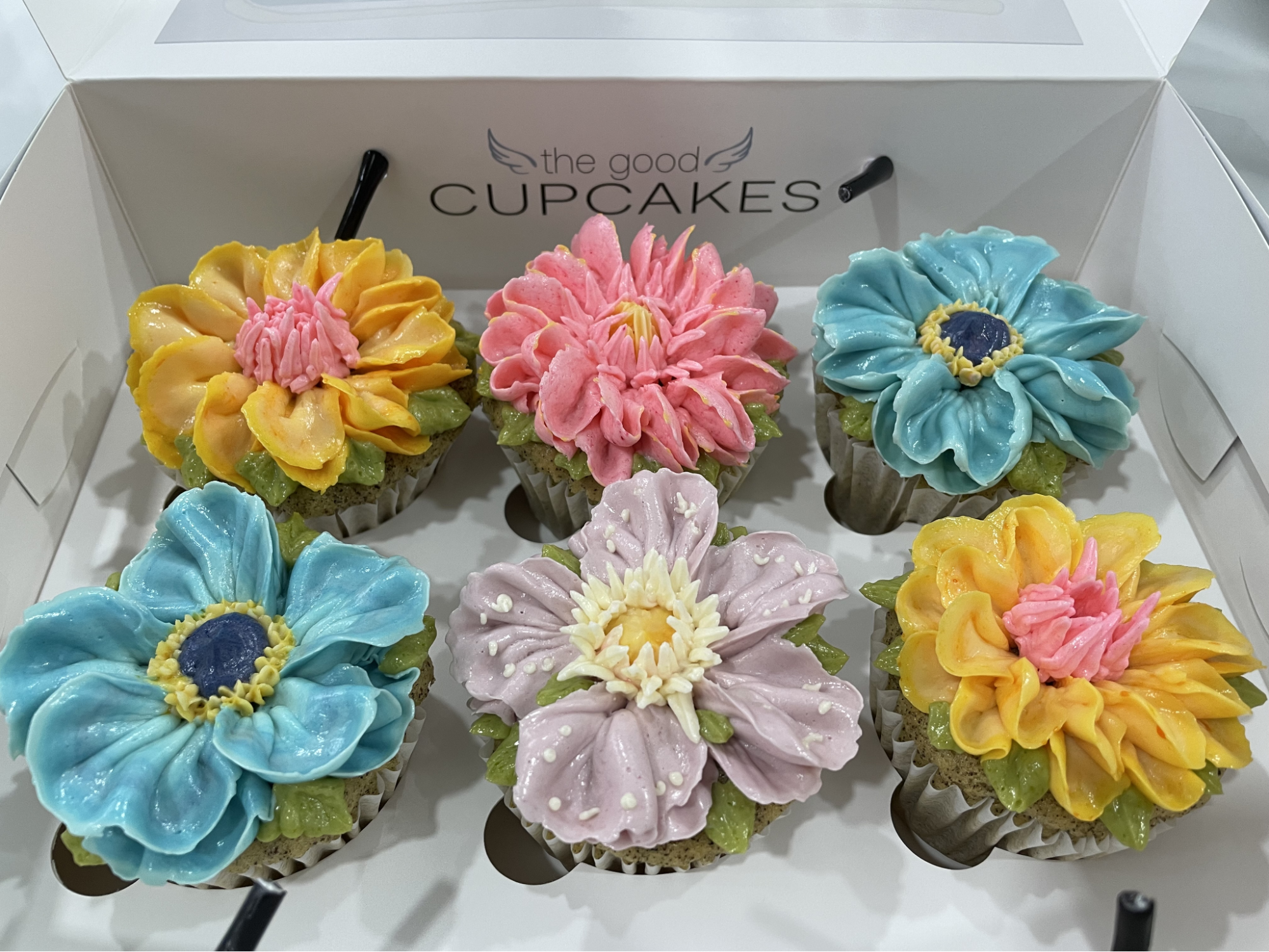 the-good-cupcakes-company-promenade-at-pelikat-flatlay