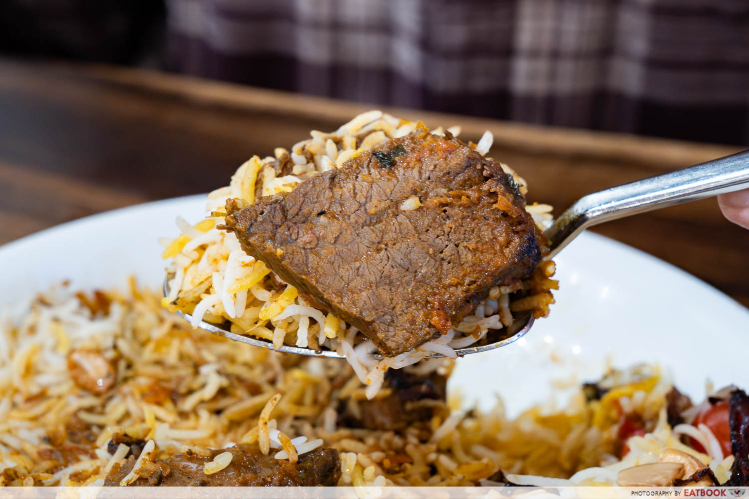 cilantro-the-biryani-club-wagyu-brisket-biryani-spoon-interaction